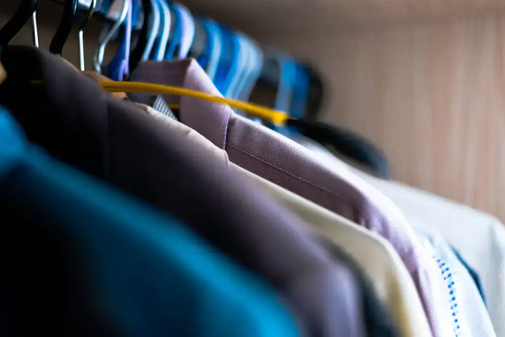 Crisp freshly dry cleaned suit jackets on hangers